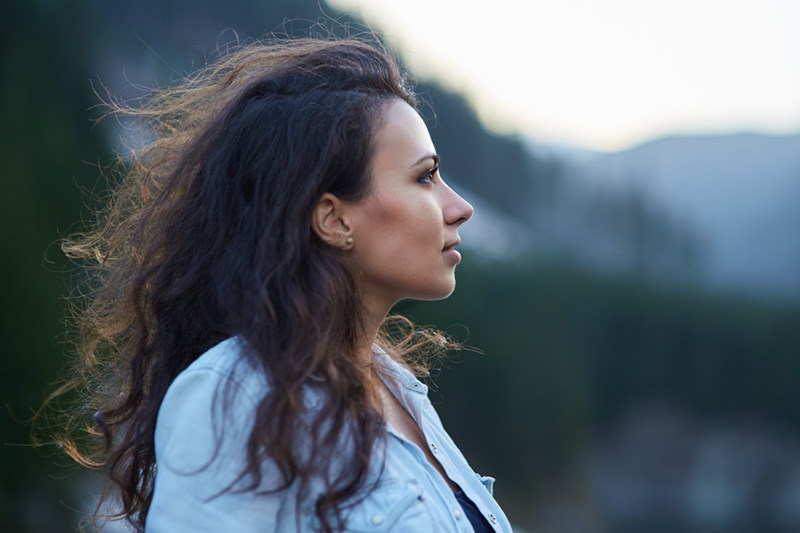 woman looking off to the side with a serious look